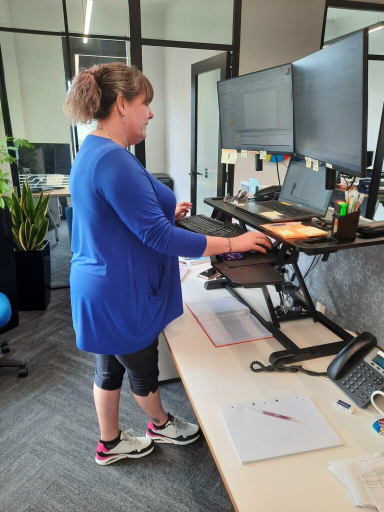 Tracey trialling the stand-up desk module